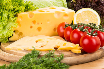 Still life with cheese on wooden board