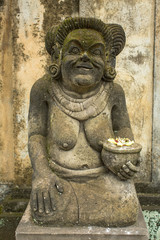 Traditional guard statue carved in stone on Indonesia.