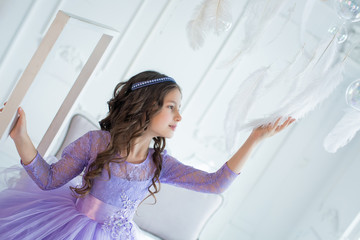 Portrait of little girl in luxurious dress