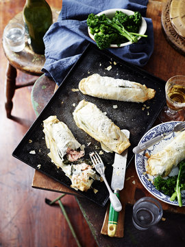 Salmon spinach filo pies, broccolini and wine