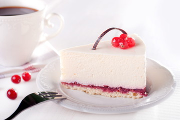 tasty piece of cake with berries in saucer