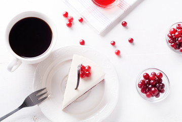 piece of cake with berries and coffee, top view