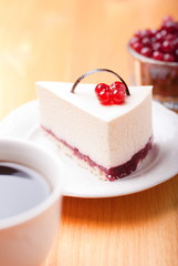 tasty piece of cake with berries in saucer