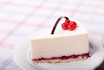 piece of cake with currant on the table
