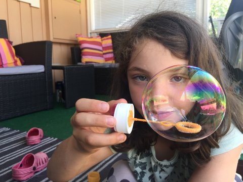 Girl with soap bubble. 
