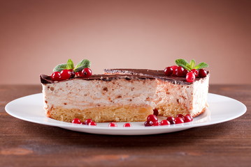 delicious cake with chocolate frosting and berries