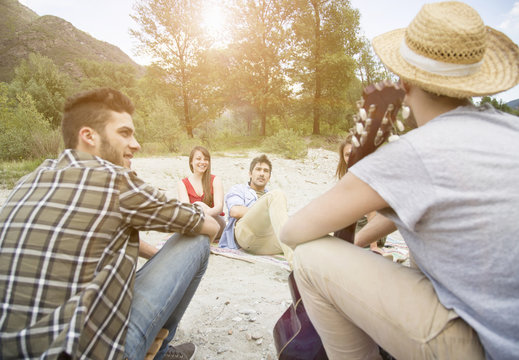 Friends sitting having picnic