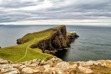 Neist Point, Scotland - Lighthouse on a rock above the sea.
