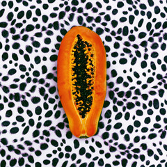 Papaya on leopard print background. Minimalism design fashion
