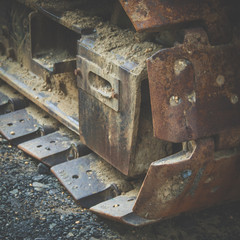 Detail of the dirty tracks of construction equipment