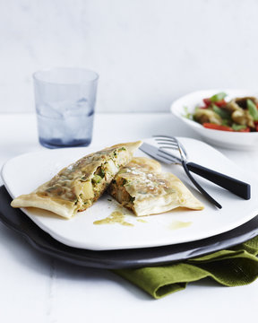 Plate with tuna and egg briks and side dish