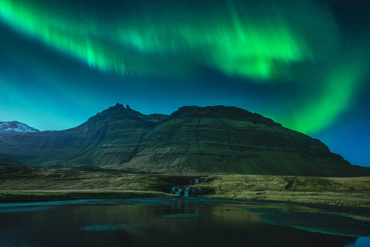 Aurora Borealis above Kirkjufellsfoss waterfall, Grundarfjordur, Snaefellsnes, Iceland