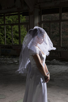 Portrait of bride in empty abandoned interior