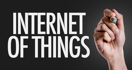 Hand writing the text: Internet of Things