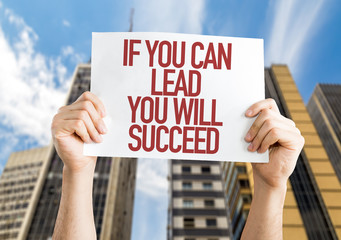 If You Can Lead You Will Succeed placard with urban background