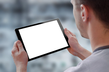 Tablet with isolated screen for mockup in man hands. City life in background. Isolated device...