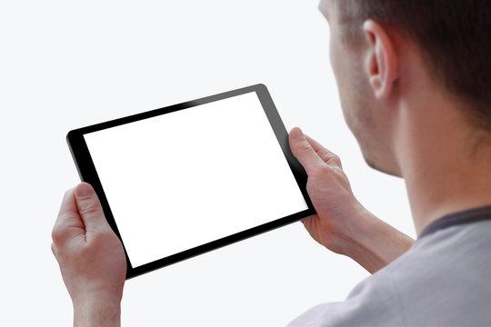 Tablet with isolated screen for mockup in man hands. Isolated white background. Isolated device screen for design, interface promotion.