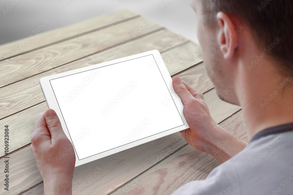 Poster tablet with isolated screen for mockup in man hands. city life in background. isolated device screen
