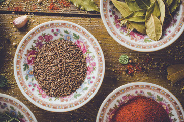 Overhead shot of cumin in porcelain bowl