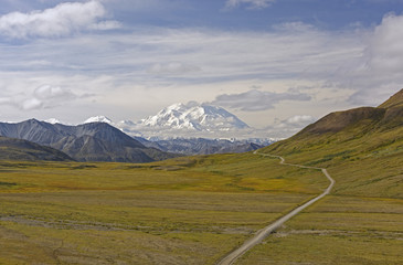 Fototapeta na wymiar Dramatic Peak Viewed Across the Tundra