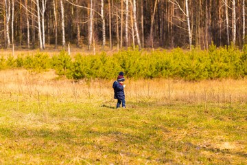 Caucasian boy playing outdoor.