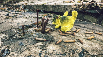 After the war.Old toy and ammunition in the wreckage of the building