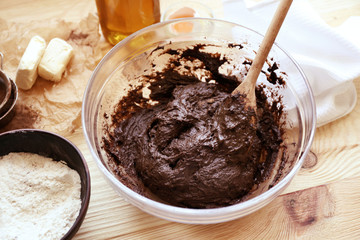 Preparing dough for chocolate pie on table close up