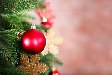 Obraz na płótnie Canvas Christmas tree with decor on bright background, closeup