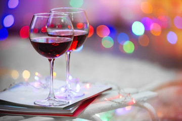 Two glasses of red wine on Christmas decoration background