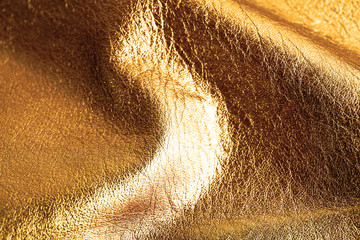 Dark brown shiny leather texture close up