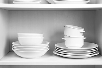 Dishes in cupboard in the kitchen
