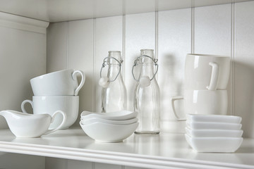 Dishes in cupboard in the kitchen