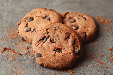 Chocolate chip cookies on dark grey background, top view