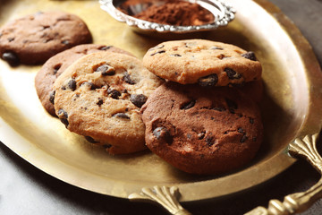 Fototapeta na wymiar Chocolate chip cookies on a metal tray, closeup
