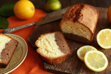 Delicious sweet cake bread on wooden cutting board closeup