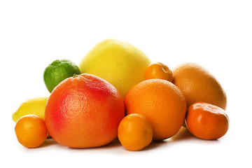 A heap of mixed citrus fruit including a grapefruit, oranges, lemons, clementines, tangerines,...