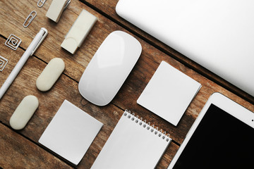 Set of office stationery with a computer on a wooden background