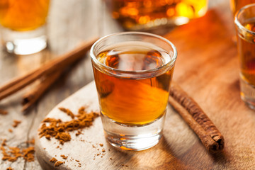 Cinnamon Whiskey Bourbon in a Shot Glass