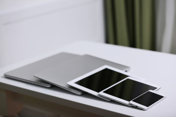 A set of electronic devices on a white desk