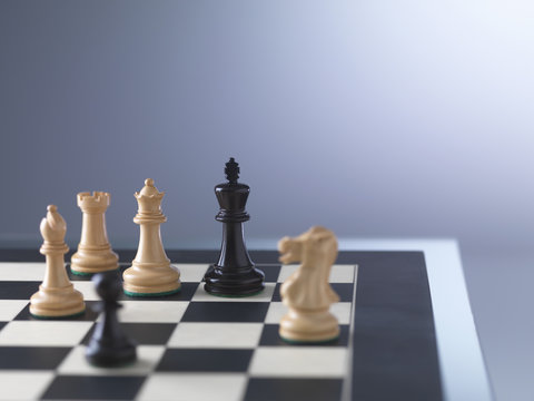 Chess game, player preparing to check mate