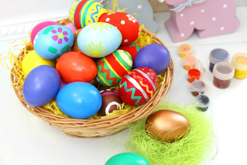 Fototapeta na wymiar Colorful Easter eggs on white table closeup