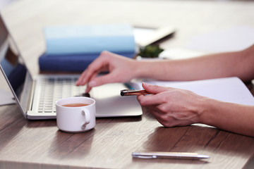 Fototapeta premium Businesswoman typing on keyboard in office
