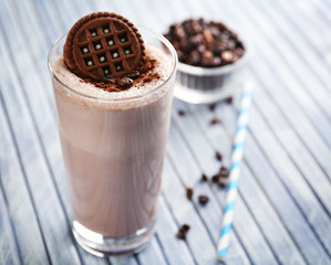 Delicious milk shake cocktail on wooden table, close up