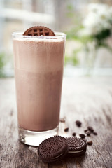 Delicious milk shake cocktail on rustic wooden table, close up