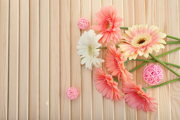 Bouquet of pink and white gerberas on wooden background