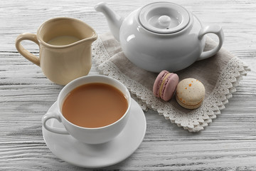 Milk tea with tea pot on white background.