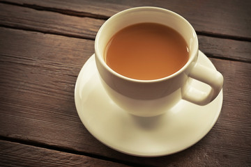 Milk tea on wooden background.