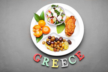 Traditional Greek lunch on brown background