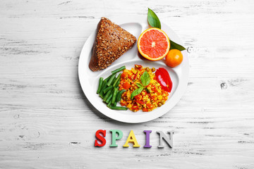 Traditional Spanish lunch on white wooden background