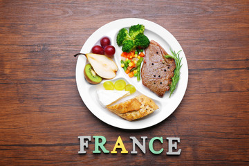 Traditional French lunch on wooden background